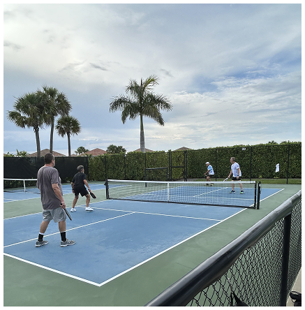 Active adults playing pickleball at PGA Verano 55+ community in Port St. Lucie, Florida