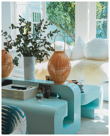Bright living room with modern blue furniture, woven decor accents, and natural light in a Port St. Lucie home
